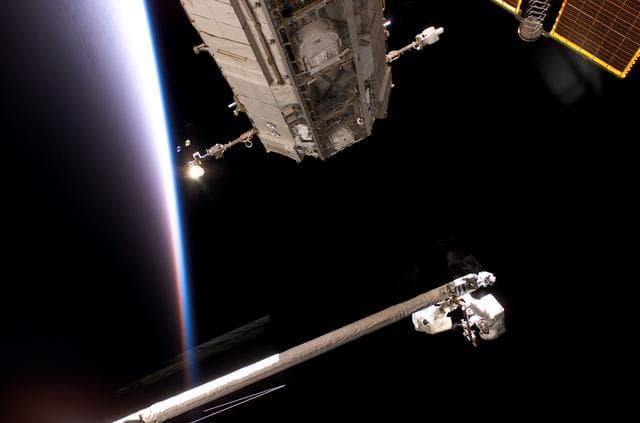 NASA image: Fossum and Sellers on the OBSS during EVA1 on STS-121 / Expedition 13 joint operations