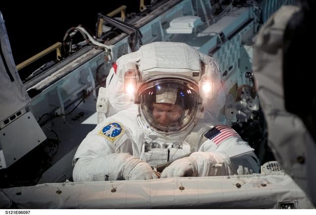 NASA image: Sellers at the orbiter BKHD after completing the task for EVA1 on STS-121 / Expedition 13 joint operations