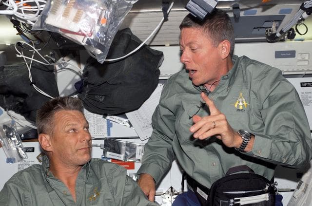 NASA image: Fossum and Sellers talk on the MDK during STS-121 / Expedition 13 joint operations