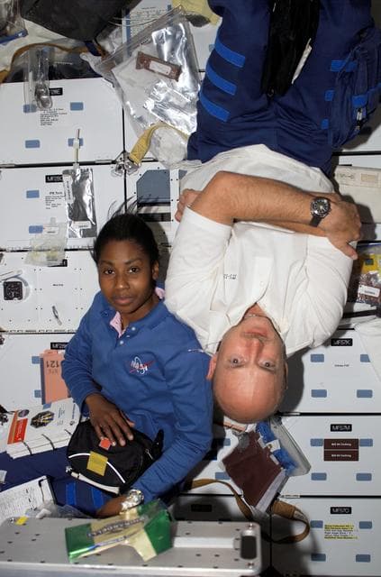 NASA image: Wilson and Kelly pose for a picture during pre-sleep activities on STS-121 / Expedition 13 joint operations