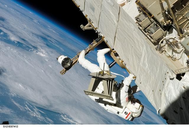 NASA image: Sellers translates along the S1 Truss during EVA3 on STS-121 / Expedition 13 joint operations