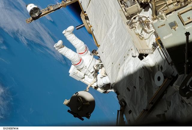 NASA image: Sellers translates along the S1 Truss during EVA3 on STS-121 / Expedition 13 joint operations