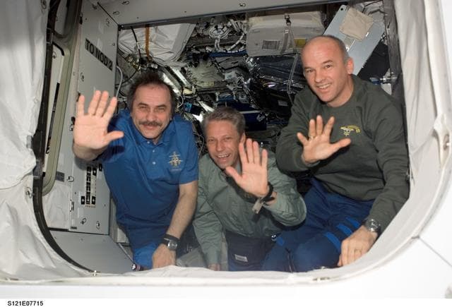 NASA image: Expedition 13 and STS-121 crewmembers say farewell before STS-121 undocking