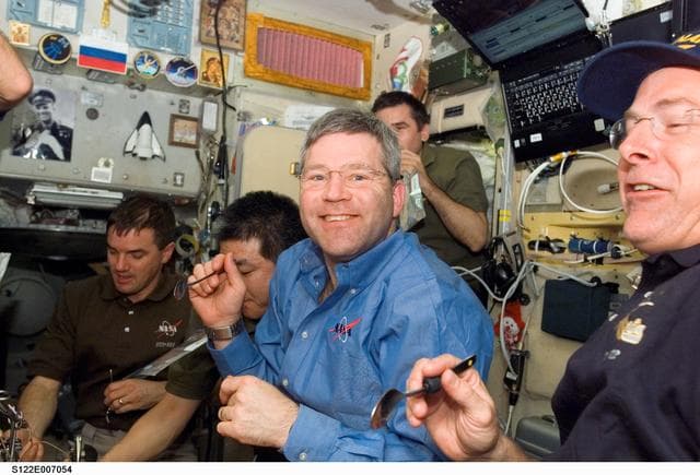 NASA image: Crewmembers share a meal in the SM