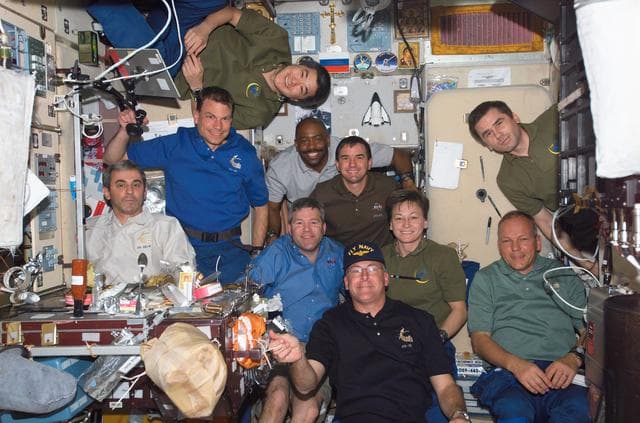 NASA image: Crewmembers share a meal in the SM