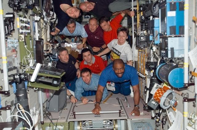 NASA image: Crewmembers in SM during Expedition 16/STS-122 Joint Operations