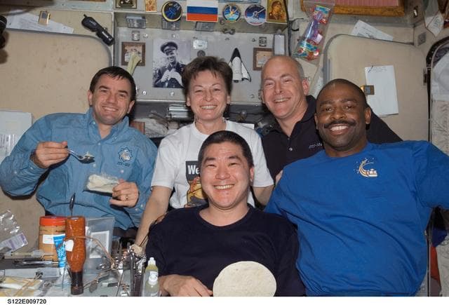 NASA image: Crewmembers share a meal in SM