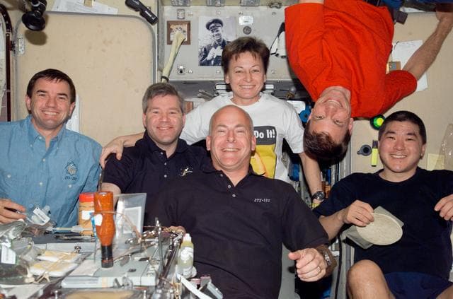 NASA image: Crewmembers share a meal in SM