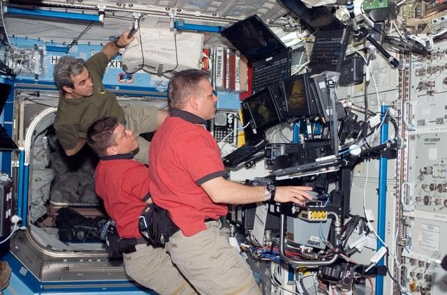 NASA image: STS-123 Crewmembers work in the U.S. Laboratory/Destiny