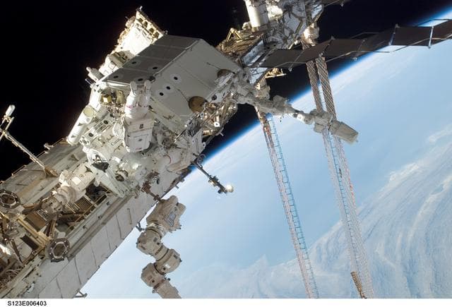 NASA image: Linnehan and Foreman on EVA 2 during STS-123 / Expedition 16 Joint Operations