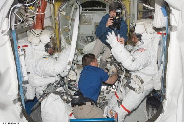 NASA image: Whitson takes photo of EMU gloves after EVA 2 in the A/L during Joint Operations