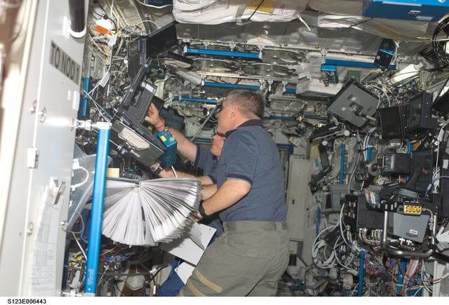 NASA image: Johnson works the controls of Robotic Canadarm2 in the U.S. Laboratory during Joint Operations