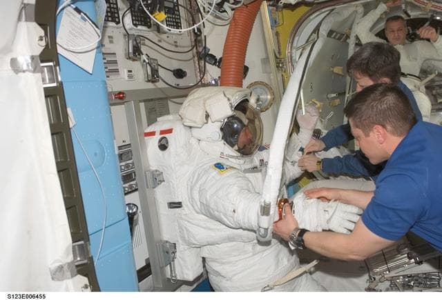 NASA image: Foreman and Linnehan after EVA 2 in the A/L during Joint Operations