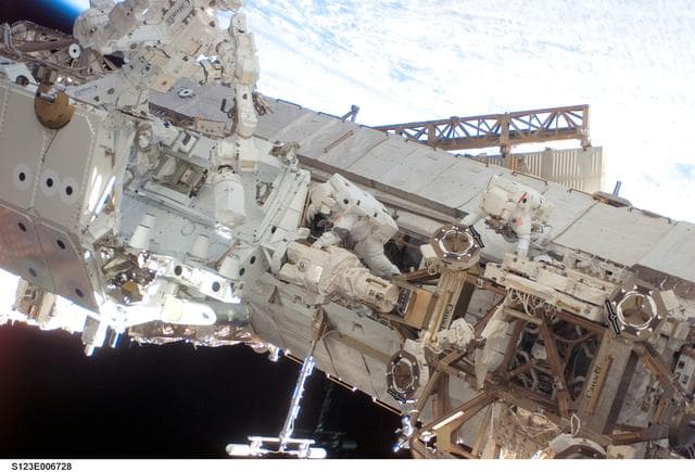 NASA image: Linnehan and Behnken work on the Dextre on EVA 3 during Expedition 16 / STS-123 Joint Operations