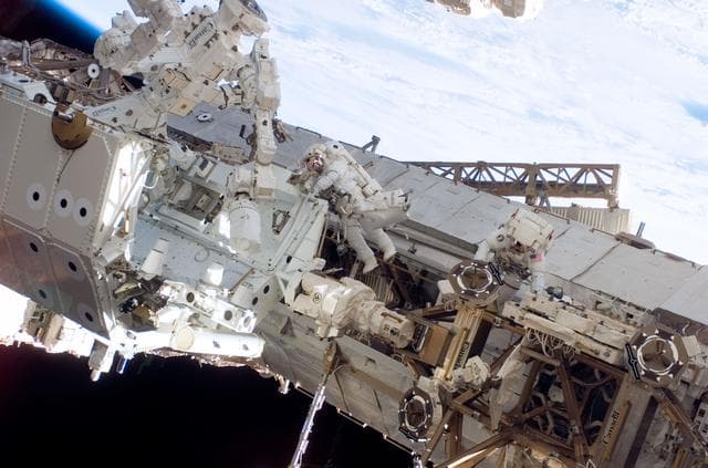 NASA image: Linnehan and Behnken work on the Dextre on EVA 3 during Expedition 16 / STS-123 Joint Operations