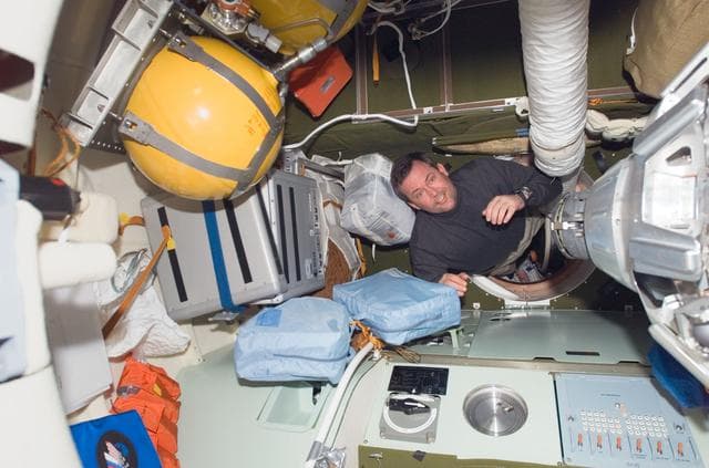 NASA image: Foreman moves through Pirs DC 1 hatch during Joint Operations