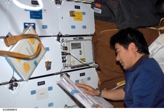 NASA image: Doi looks at crew procedures in the FWD MDDK during Joint Operations