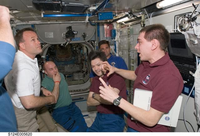 NASA image: STS-124 and Expedition 17 crew greet after docking