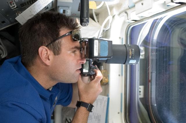 NASA image: Chamitoff on aft flight deck with camera