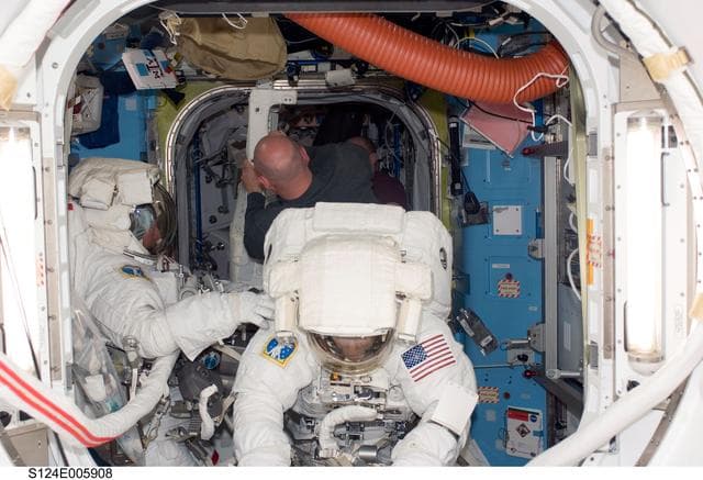 NASA image: Garan and Fossum in airlock prior to EVA 1