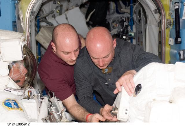 NASA image: Reissman and Kelly in airlock prior to EVA 1