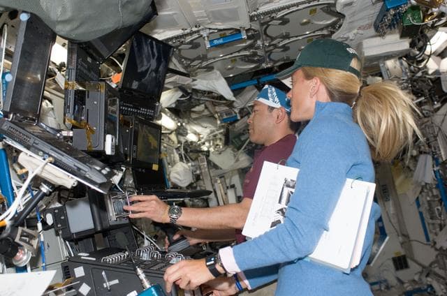 NASA image: Nyberg and Hoshide in U.S. Lab during Kibo installation during EVA 1