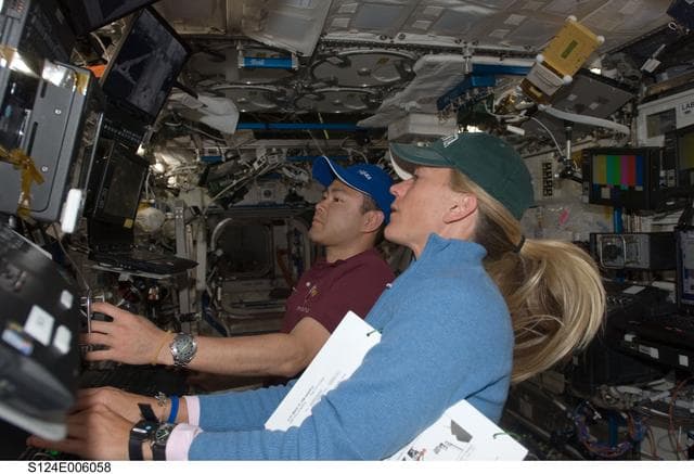 NASA image: Nyberg and Hoshide at SSRMS controls