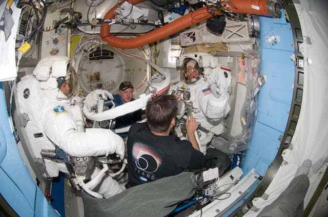 NASA image: Preparing for EVA 3 in Quest airlock
