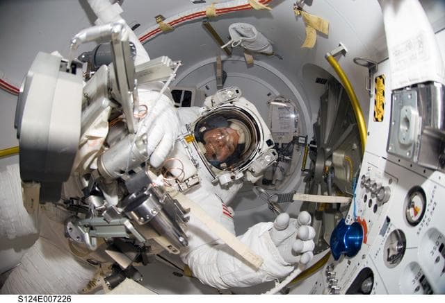 NASA image: Preparing for EVA 3 in Quest airlock