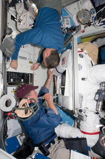 NASA image: Fossum  and Garan in Airlock