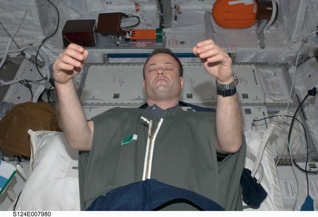 NASA image: Garan in sleeping bag in Columbus module
