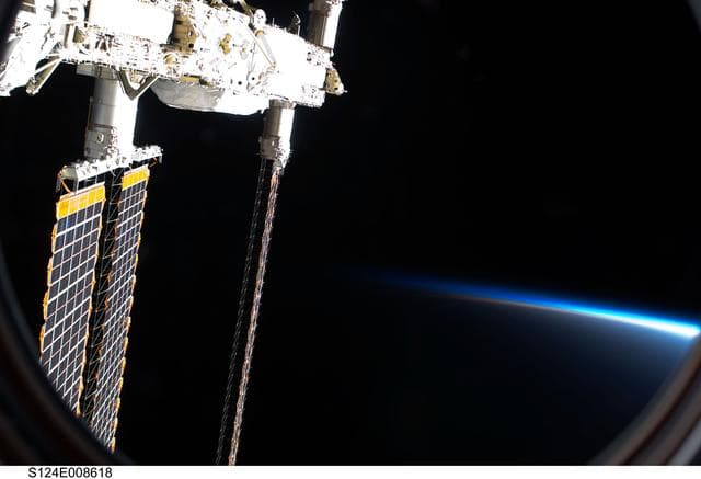 NASA image: Solar array panels seen from  JPM window