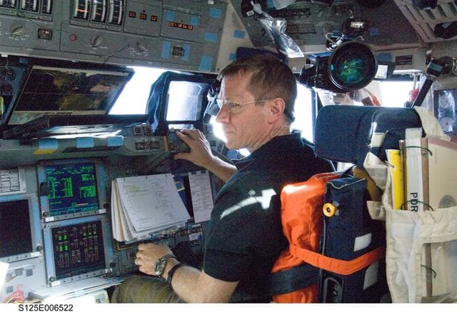 NASA image:   Johnson in the Shuttle Atlantis Flight Deck