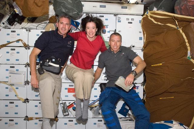 NASA image: Crew Members pose for a photo on the Shuttle Atlantis Middeck