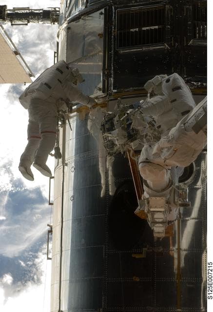 NASA image: STS-125 MS5 Feustel and MS3 Grunsfeld during EVA1