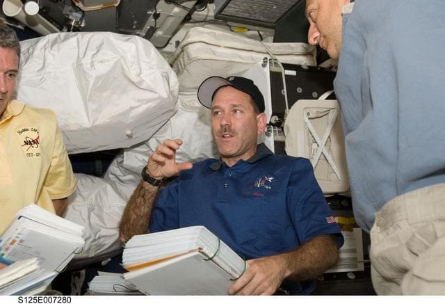 NASA image: STS-125 Crew Members in the Middeck during Flight Day 3