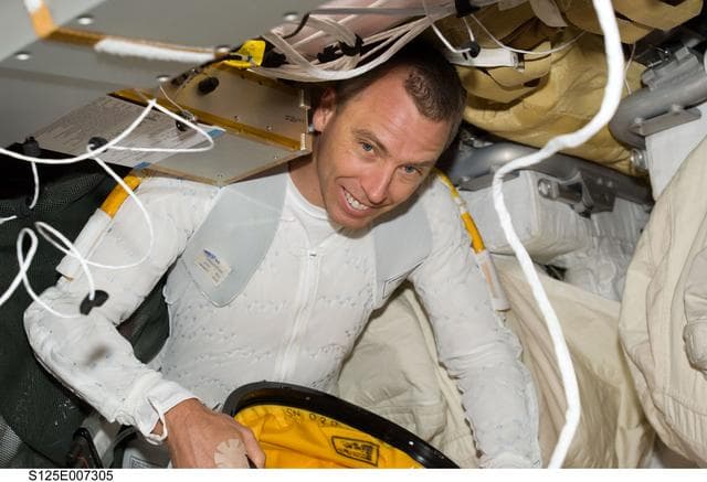 NASA image: STS-125 MS5 Feustel prepares for EVA1 in the Middeck