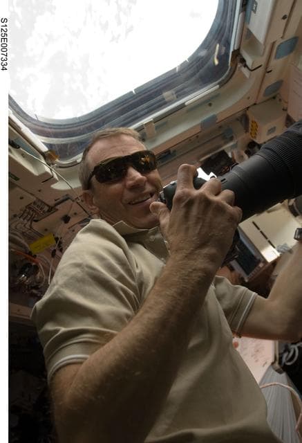 NASA image: STS-125 Pilot Johnson takes photos during Flight Day 4