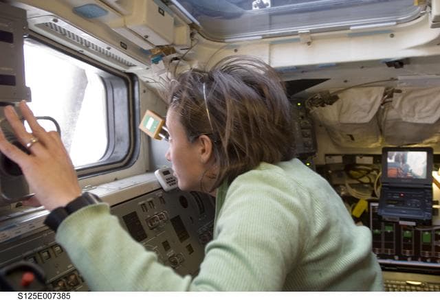 NASA image: STS-125 MS2 McArthur works on the Flight Deck during EVA1