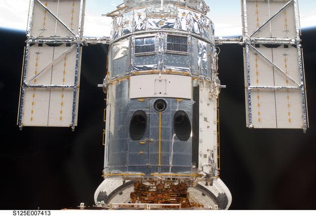 NASA image: View of the HST docked with the Space Shuttle Atlantis