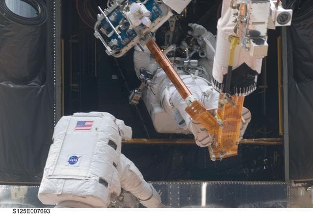 NASA image: STS-125 MS1 Good and MS4 Massimino during EVA2
