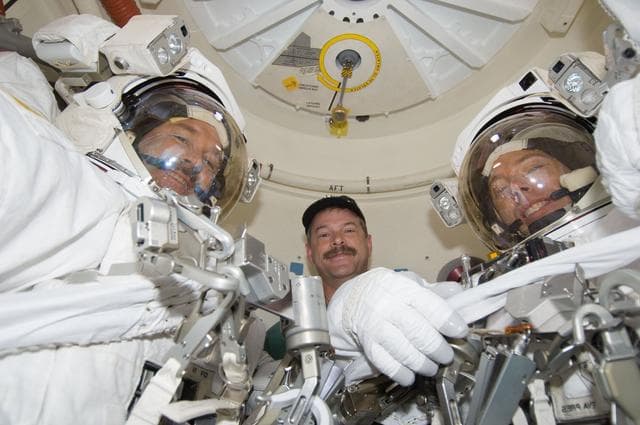 NASA image: STS-125 Crew Members pose for a photo in the Airlock prior to EVA3