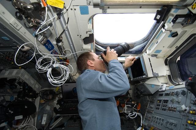 NASA image: STS-125 Pilot Johnson takes photos on the aft FD during Flight Day 6
