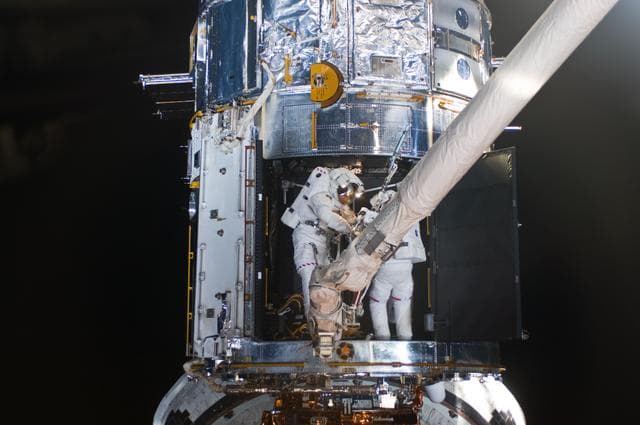NASA image: STS-125 MS1 Good and MS4 Massimino during EVA4