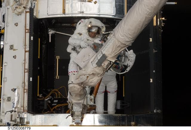 NASA image: STS-125 MS1 Good and MS4 Massimino during EVA4