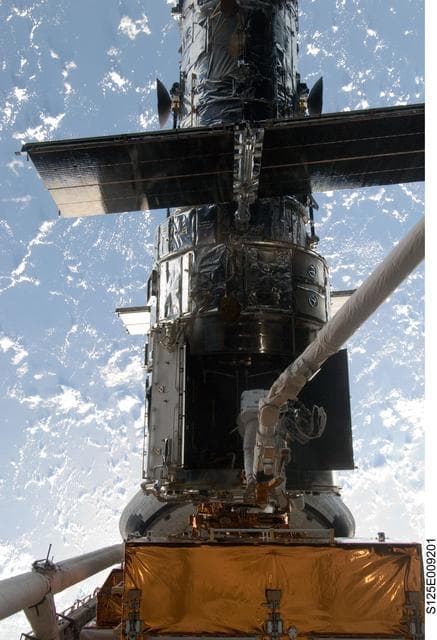 NASA image: STS-125 MS1 Good and MS4 Massimino during EVA4
