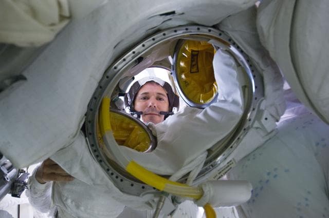 NASA image: STS-125 Crew Member poses for a photo on the Middeck prior to EVA4