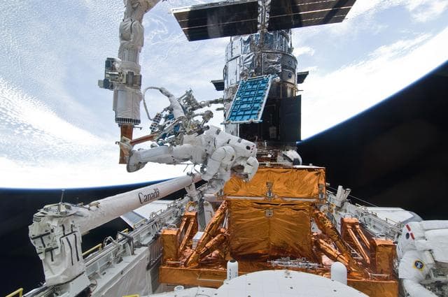 NASA image: STS-125 MS1 Good and MS4 Massimino during EVA4
