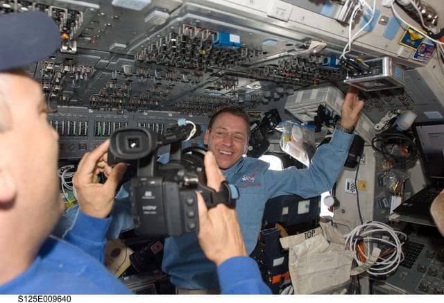 NASA image: STS-125 Crew Members on the Flight Deck during Flight Day 8