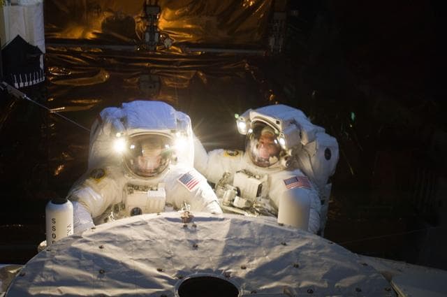 NASA image: STS-125 MS3 Grunsfeld and MS5 Feustel during EVA5